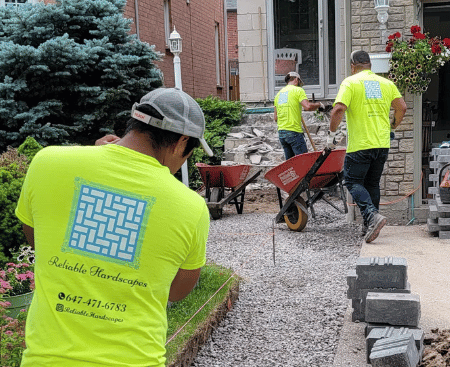 reliable Hardscapes in action installing an interlocking porch